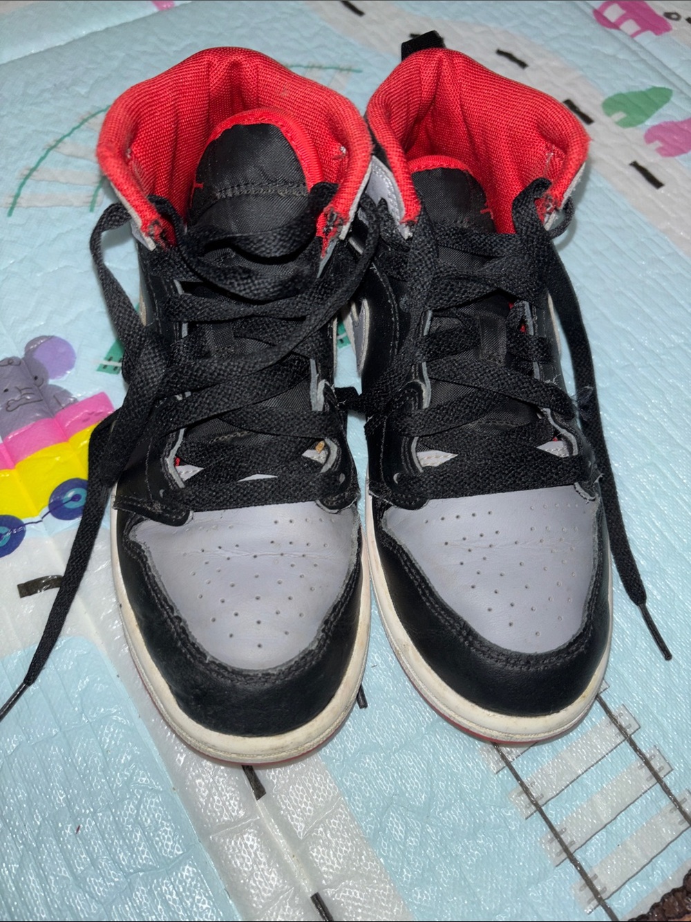 Nike Kids Black and Gray High-Top Sneakers with Red Lining